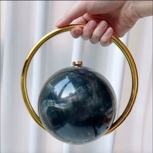 Round Marble Effect Orb Clutch with Gold Ring Handle